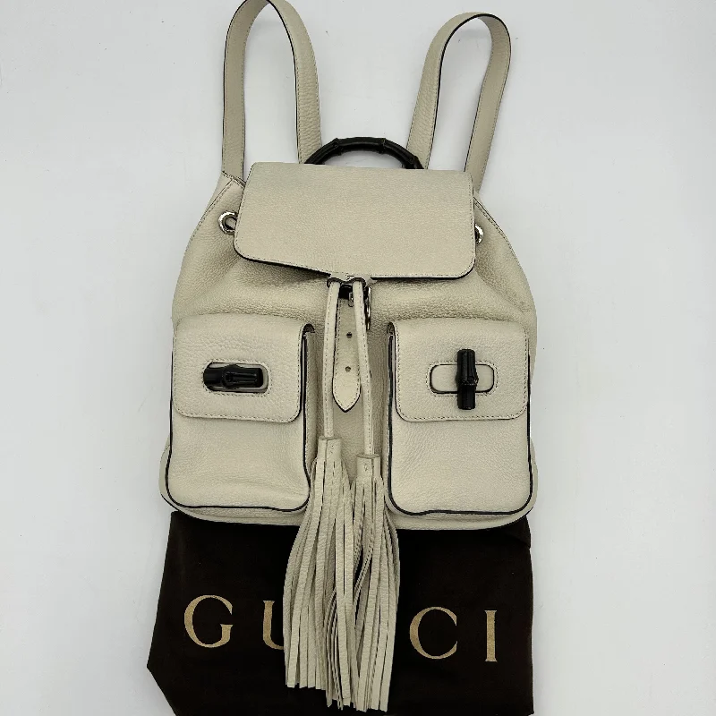 Women Gucci Sylvie bags featuring the signature web stripeWomen Gucci Sylvie bags featuring the signature web stripeGucci Leather Bamboo Tassel Backpack White