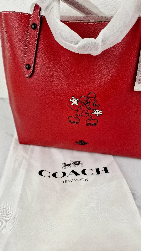 Coach Rogue bags with a detachable shoulder strap for versatile carryingDisney x Coach Red Tote Bag with Mickey Mouse on Roller Skates LIMITED EDITION - Coach 69181