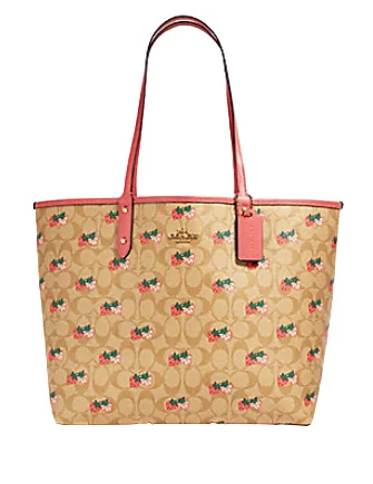 Coach Dempsey bags with a large capacity and a drawstring closureCoach Reversible City Tote in Signature Canvas With Strawberry Print