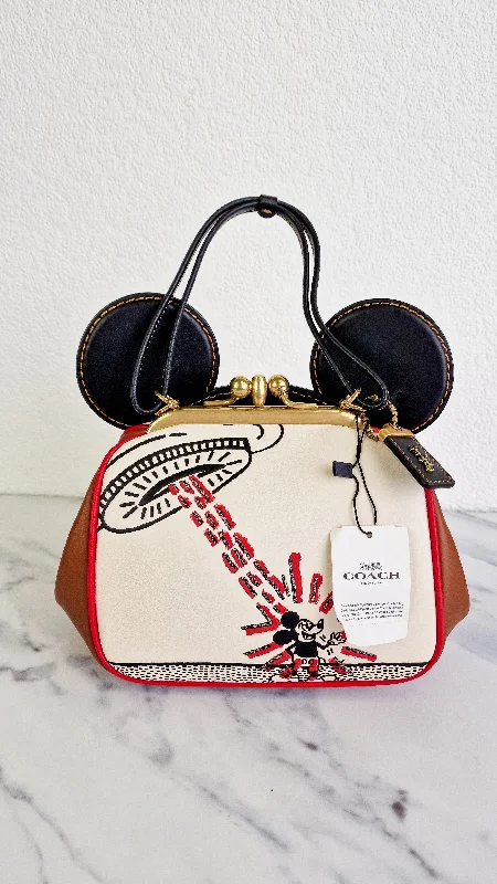 Coach Dempsey bags with a large capacity and a drawstring closureDisney x Coach x Keith Haring Mickey Mouse Kisslock Bag in Smooth Leather With Mickey Mouse and Spaceship Pop Art - Crossbody Bag Handbag - Coach 4719