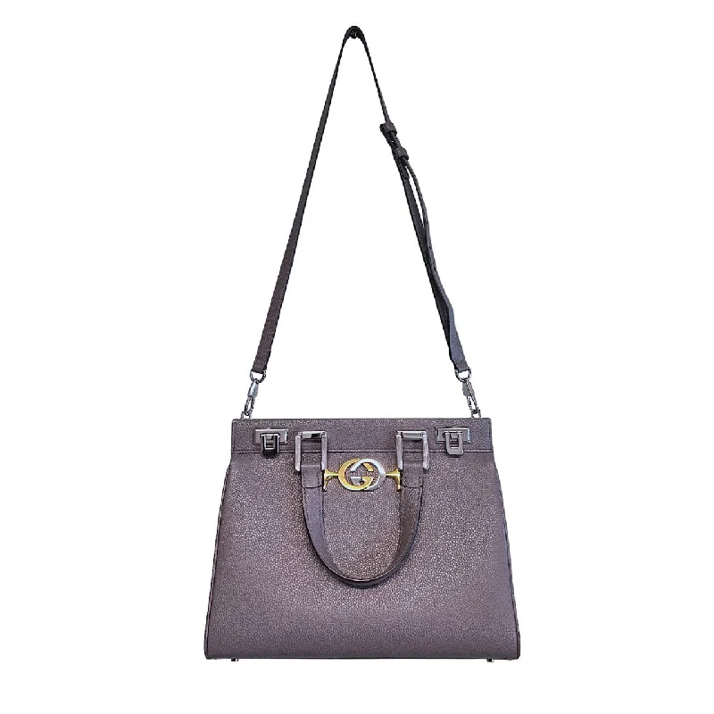 Gucci Marmont bags for women with a contrast - colored interiorGucci Marmont bags for women with a contrast - colored interiorGucci Small Zumi Top Handle Bag