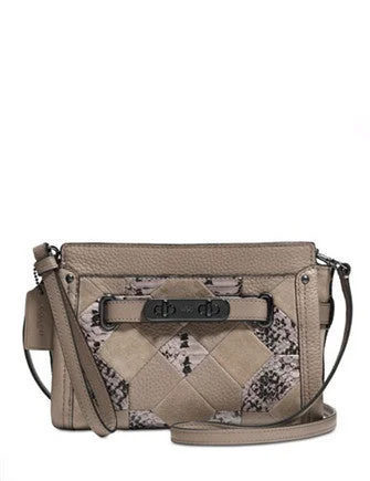 Coach bags with a chain - link trim and a leather body for a modern edgeCoach Swagger Wristlet in Patchwork Exotic Leather