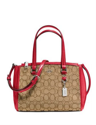 Coach Dempsey bags with a contrast - colored interior for visual interestCoach Stanton Carryall 26 in Signature Jacquard