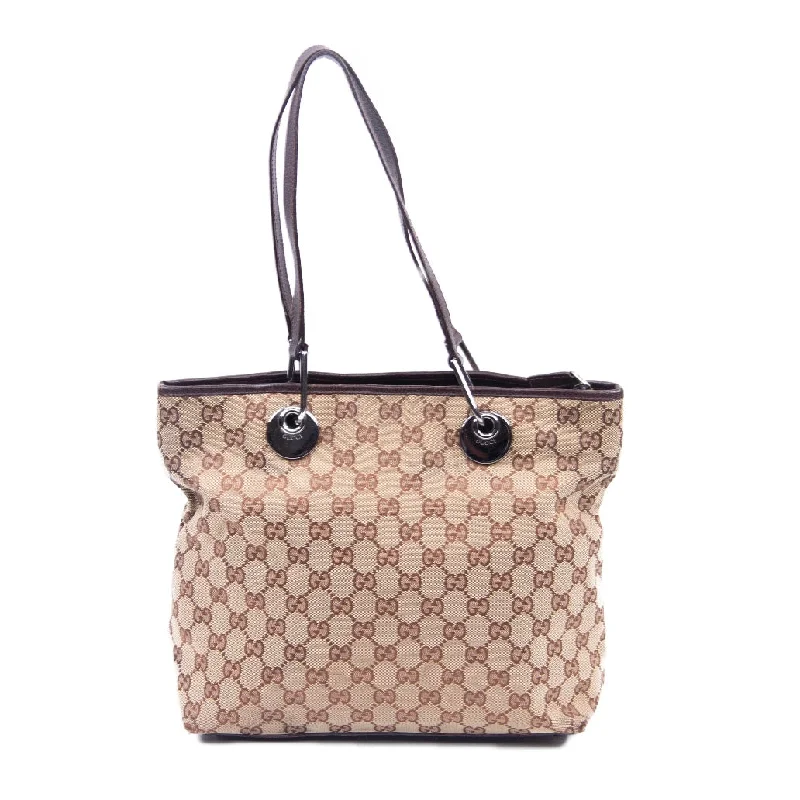 Women Gucci bags with a snap - button closure and a decorative charmWomen Gucci bags with a snap - button closure and a decorative charmBeige & Brown GG Shoulder Bag