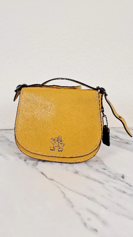 Coach backpacks with a sleek, modern design for a stylish lookDisney X Coach 1941 Saddle Bag 23 with Mickey Mouse on Roller Skates in Flax Yellow Smooth Leather Crossbody Bag LIMITED EDITION - Coach 38421