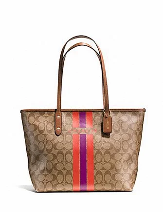 Coach crossbody bags with a printed floral pattern for a feminine touchCoach Signature Varsity City Zip Top Tote