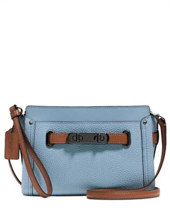 Coach handbags with a perforated leather detail for a breathable and unique designCoach Swagger Wristlet in Colorblock Pebble Leather