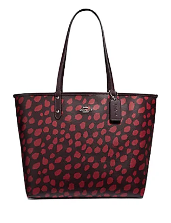 Coach handbags with a beaded trim for a glamorous and elegant lookCoach Reversible City Tote With Deer Spots