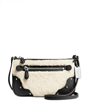 Coach bags with a detachable mobile phone holder for on - the - go useCoach Small Rhyder Pochette in Shearling