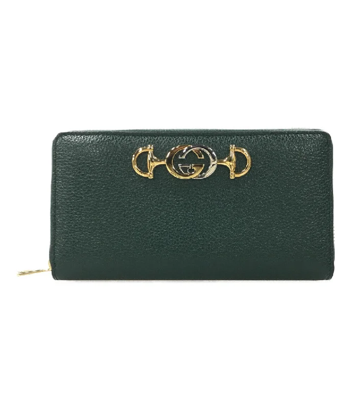 Women Gucci Sylvie bags featuring the signature web stripeWomen Gucci Sylvie bags featuring the signature web stripeGucci Dark Green Leather Clutch with Gold Hardware