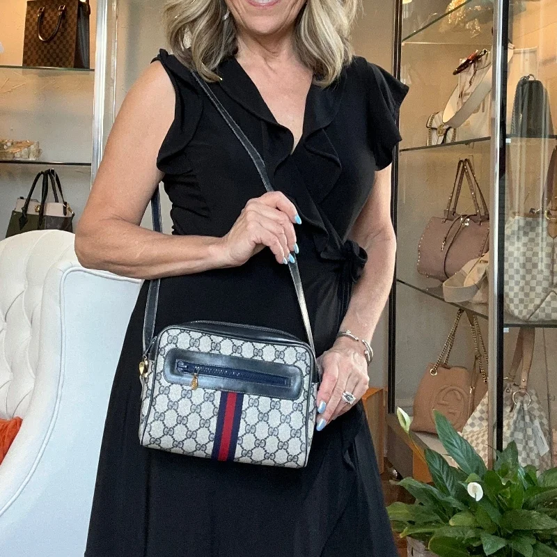 Women Gucci Sylvie bags with a leather - wrapped handleWomen Gucci Sylvie bags with a leather - wrapped handleGucci Vintage Navy Supreme Web Crossbody