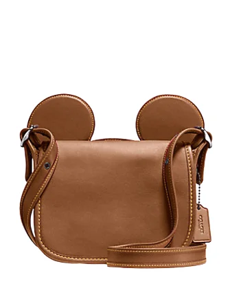 Coach crossbody bags with a woven leather strap for a unique textureCoach Patricia Saddle in Glove Calf Leather With Mickey Ears