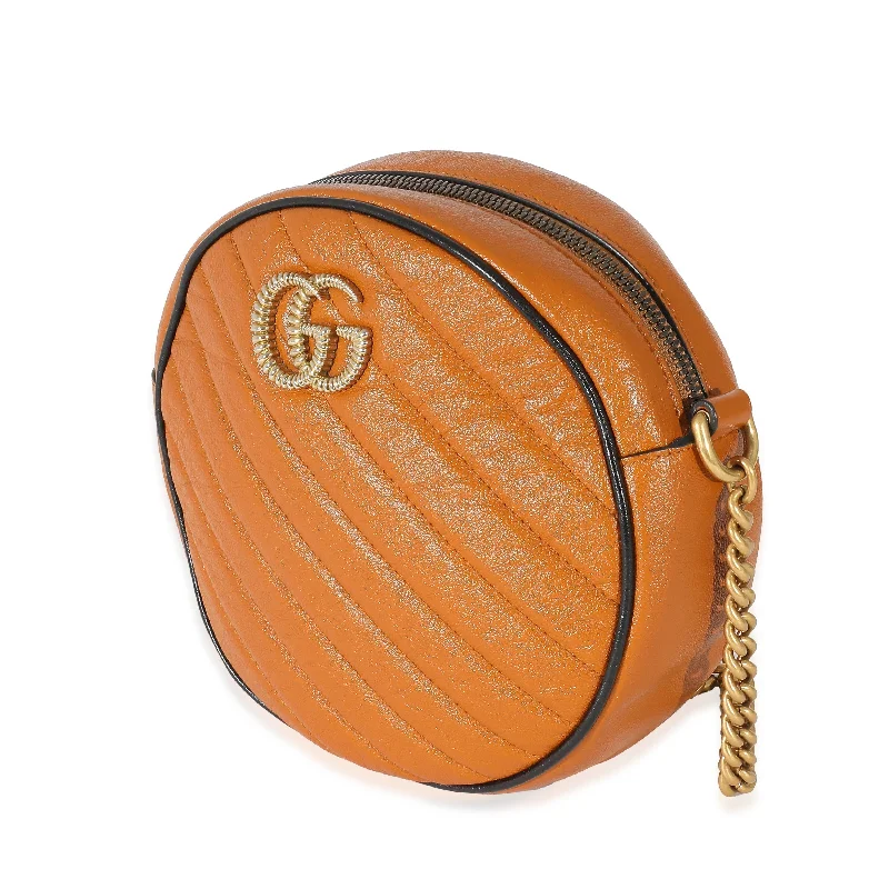 Women Gucci bags with a magnetic snap closure for easy accessWomen Gucci bags with a magnetic snap closure for easy accessGucci Cognac Vintage Effect Leather Mini Torchon GG Marmont Round Bag