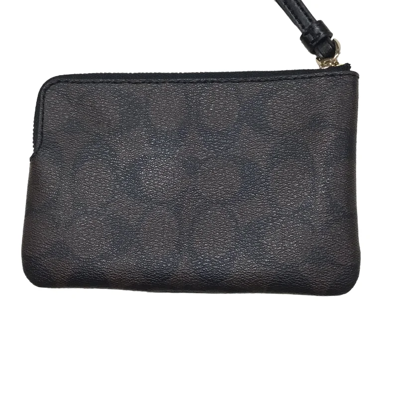 Ladies Coach shoulder bags with a magnetic - closure flap for easy accessWristlet Designer By Coach  Size: Medium