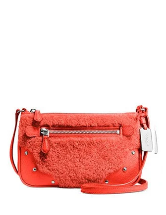 Coach bags with a back - zip pocket for storing valuables securelyCoach Small Rhyder Pochette in Shearling