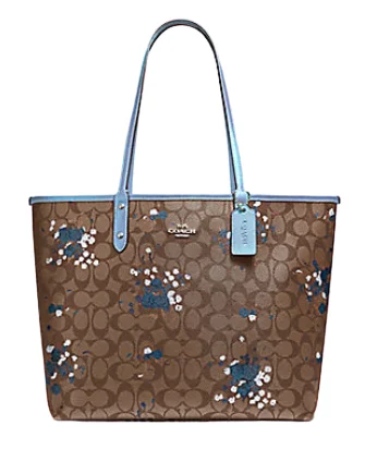 Coach bags with a detachable mobile phone holder for on - the - go useCoach Reversible City Tote in Signature Canvas with Floral Bundle