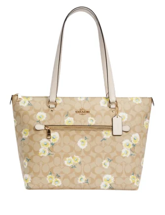 Ladies Coach Tabby bags with gold - toned hardware for a touch of luxuryCoach Gallery Tote In Signature Canvas With Daisy Print