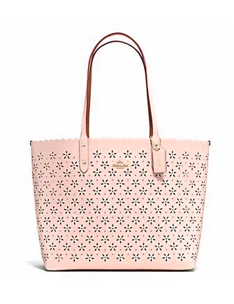 Coach bags with a zippered interior pocket for separating itemsCoach City Tote in Laser Cut Leather