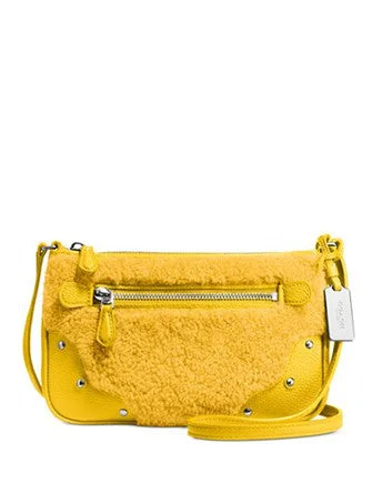 Coach Rogue bags with a detachable shoulder strap for versatile carryingCoach Small Rhyder Pochette in Shearling